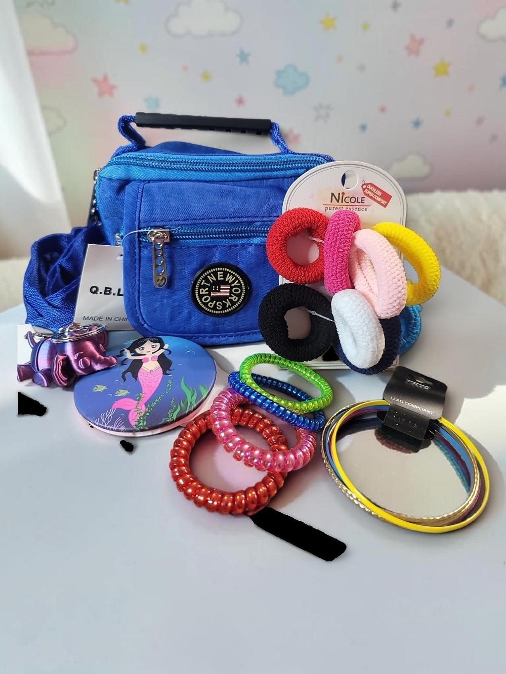 New York Sport Mini Crossbody/Belt Bag with Assorted Hair Accessories and Mirror